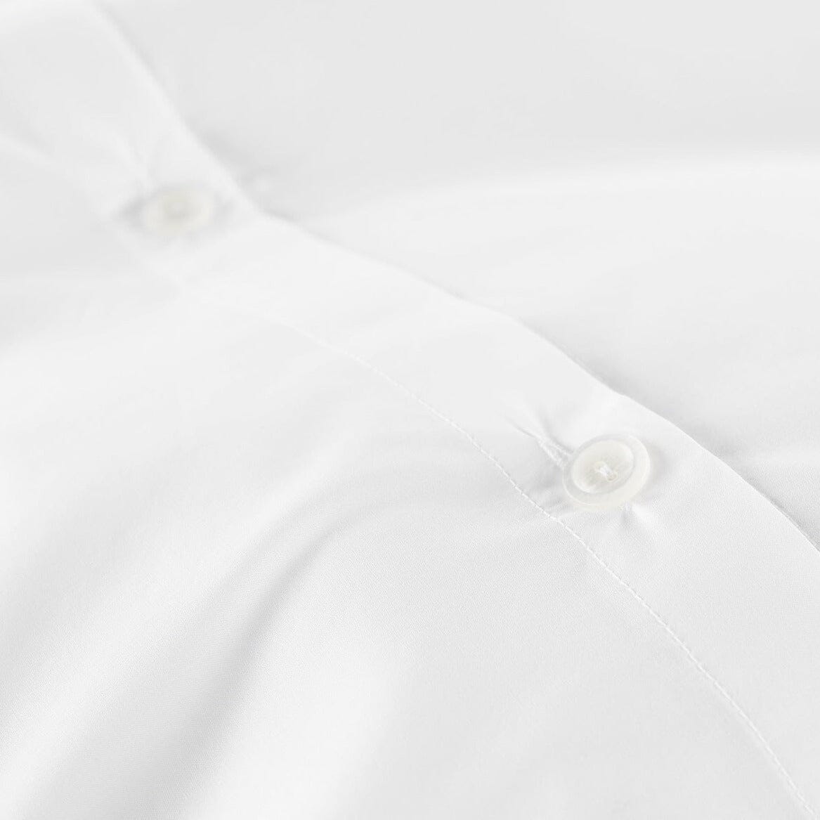 Lyric Percale Bedding in White by Peacock Alley