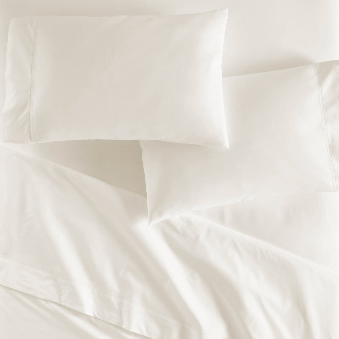 Lyric Percale Bedding in Ivory by Peacock Alley