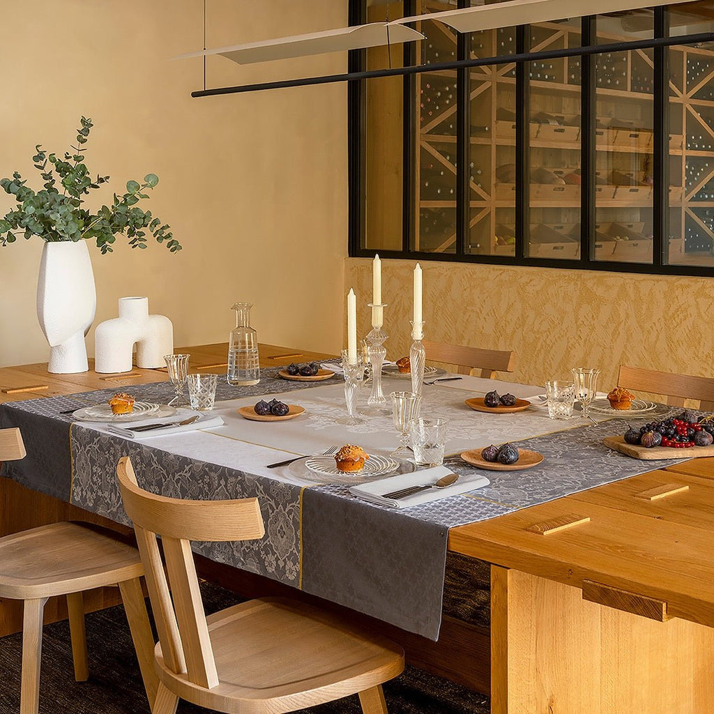 Voyage Iconique Enduit Grey Coated Tablecloth By Le Jacquard Francais
