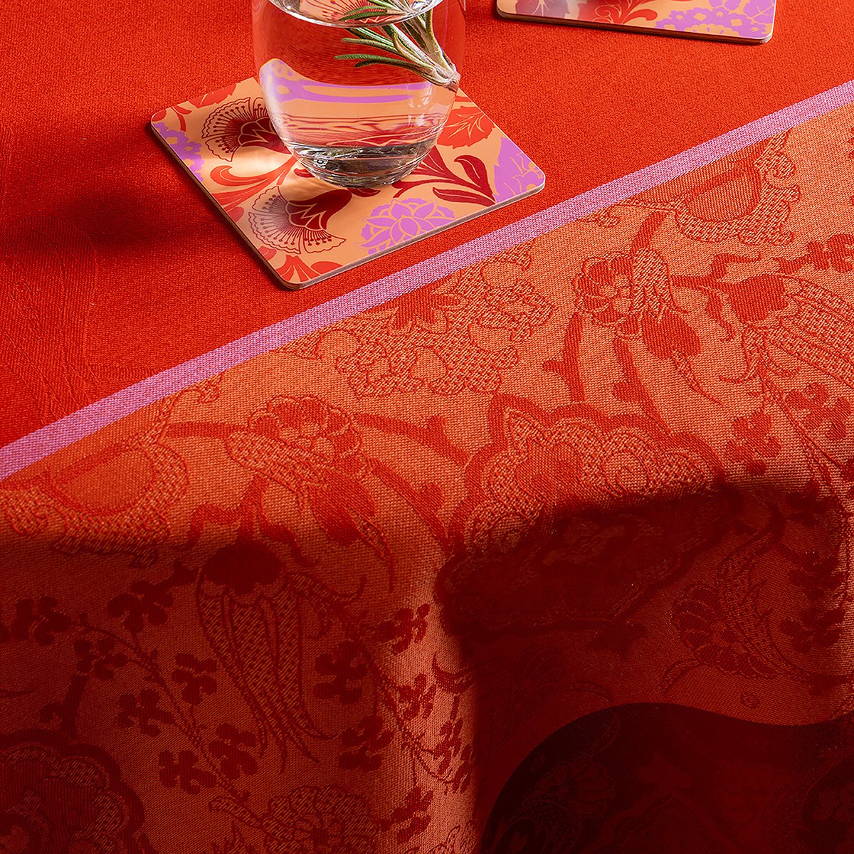 Voyage Iconique Enduit Red Coated Tablecloth By Le Jacquard Francais